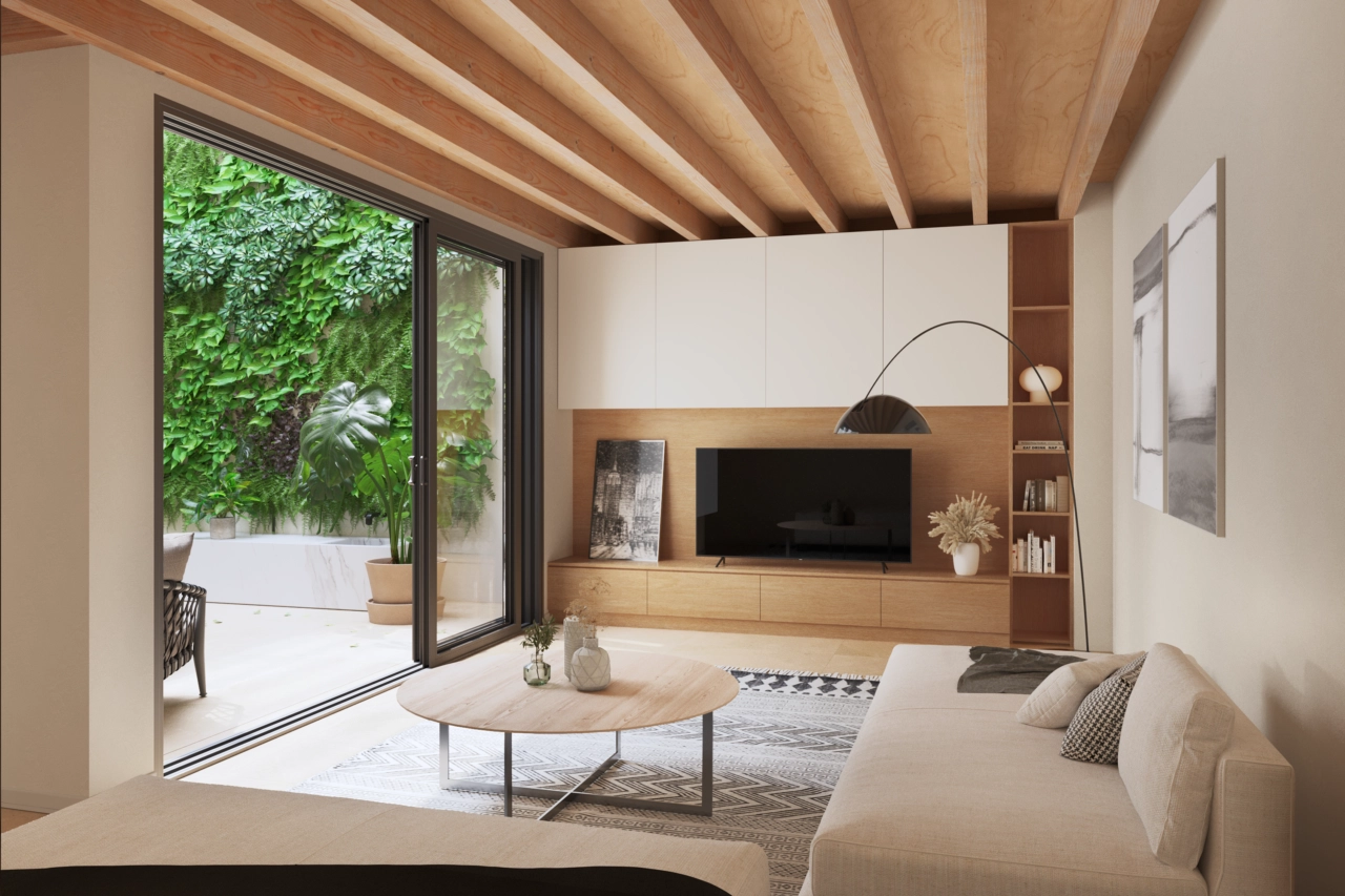 En stilfull stue med utsikt over den rolige innvendige patioen med en grønn vegg.