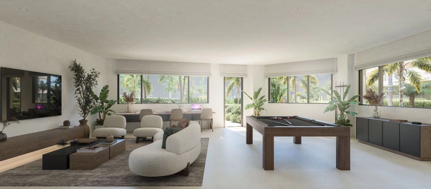 Den felles sosiale salongen, et allsidig rom for beboere å arbeide, møte eller slappe av i komfort.