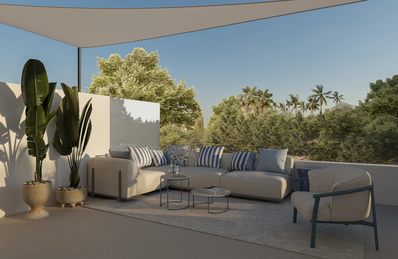 En romslig terrasse designet for komfortabelt uteliv og for å nyte det behagelige klimaet.