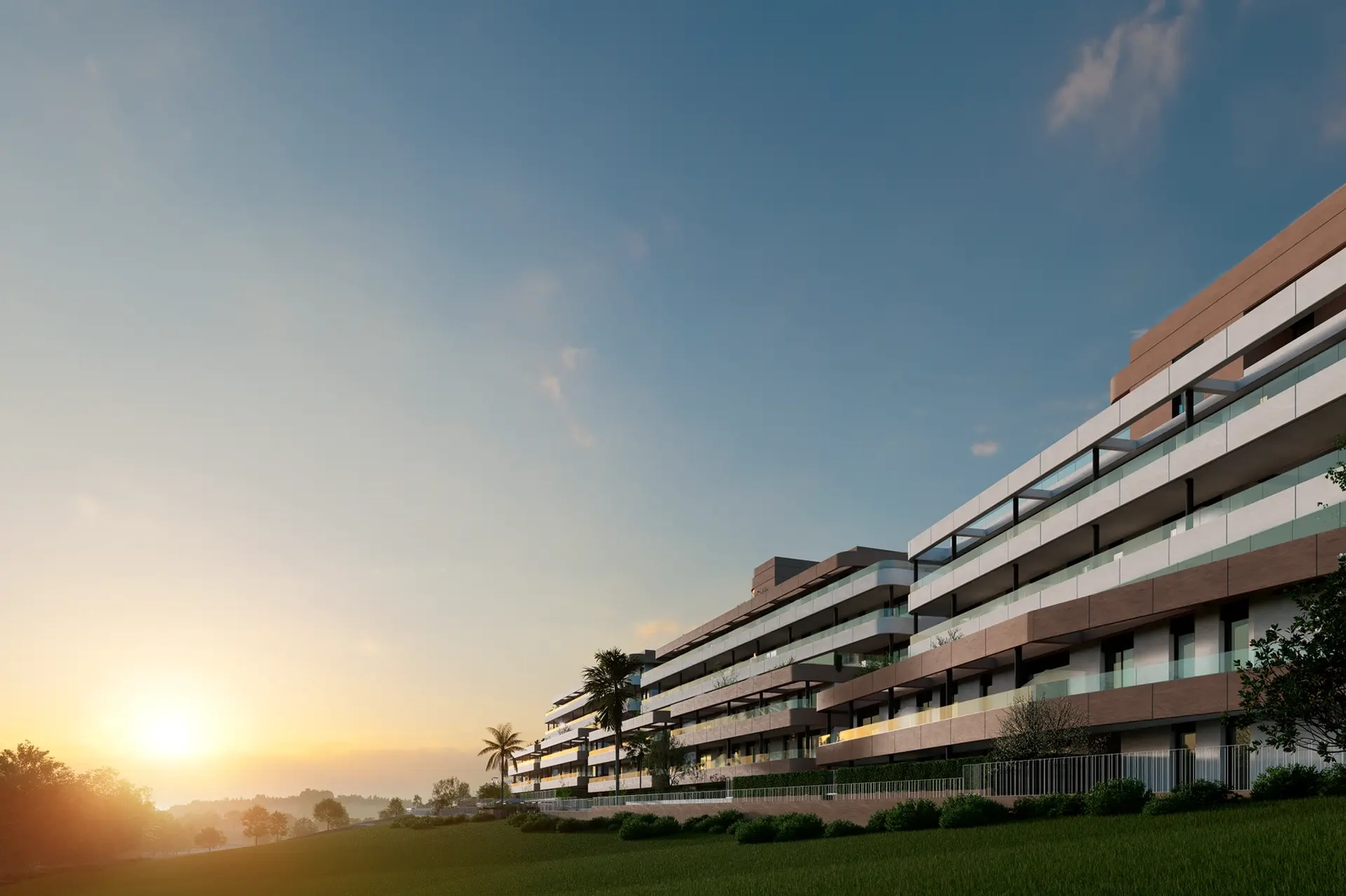 Den moderne arkitekturen i utbyggingen gløder vakkert under solnedgangens gylne time.