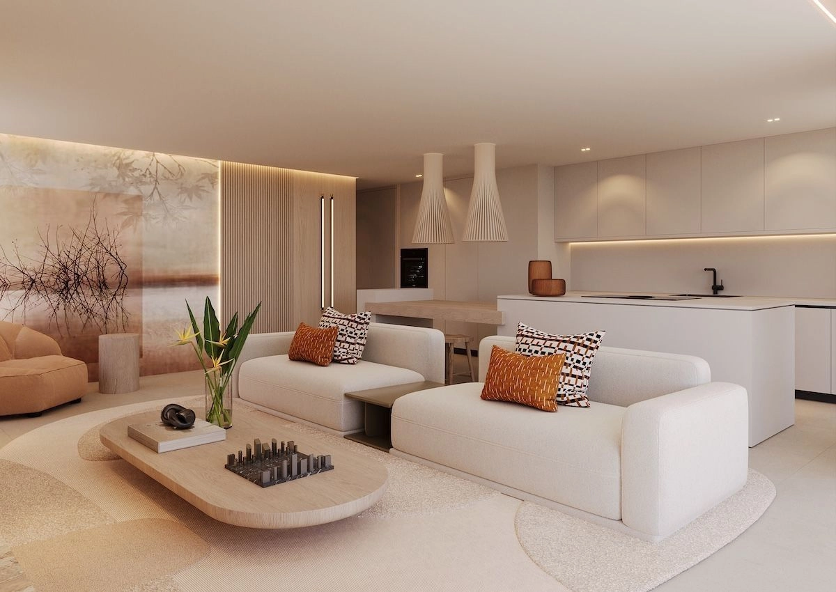 Et elegant, moderne kjøkken utstyrt med high-end hvitevarer, sømløst integrert i stue- og spiseområdene.