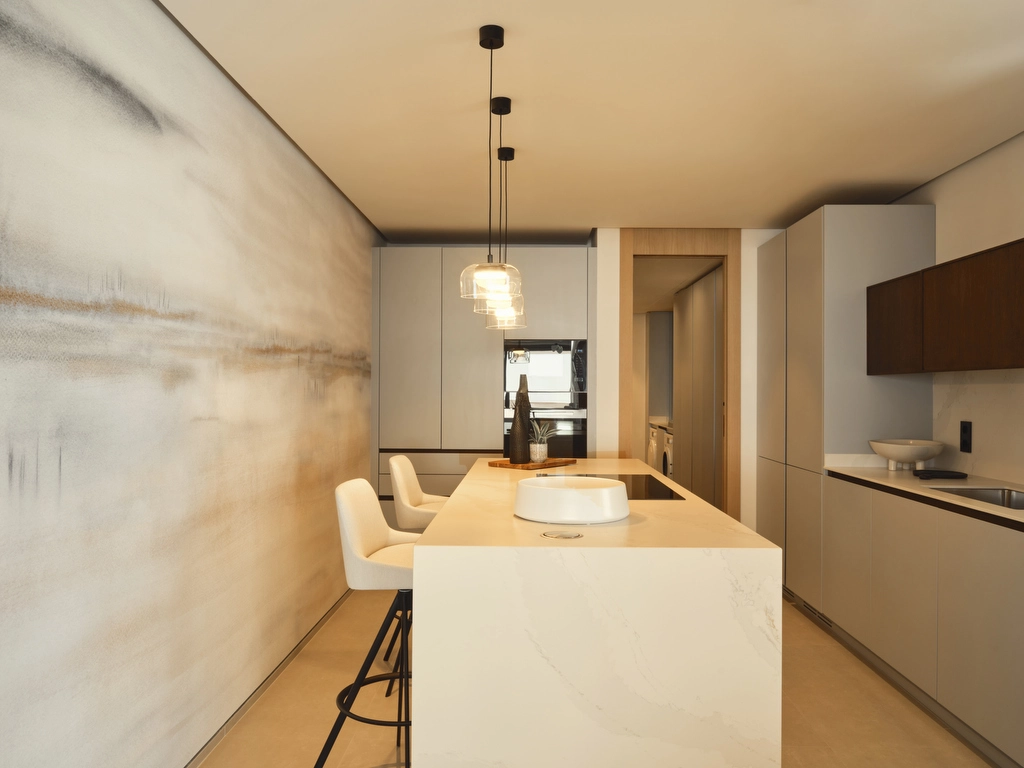 Et toppmoderne kjøkken med eksklusive hvitevarer og minimalistisk design, perfekt for både hverdagsbruk og underholdning.