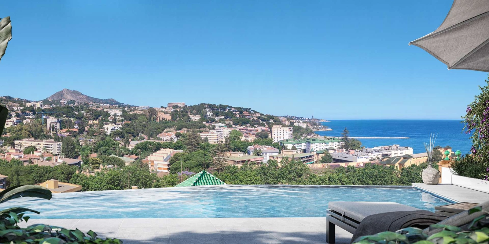 Nyt en fantastisk panoramautsikt over Malaga og Middelhavet fra beboernes svømmebasseng.