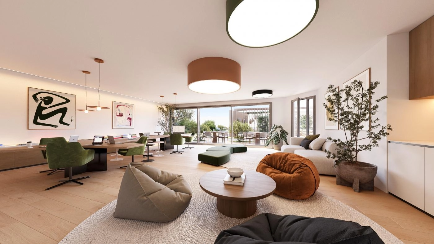 En allsidig og stilig co-working- og sosial salong hvor beboere kan jobbe, møtes eller slappe av i komfort.