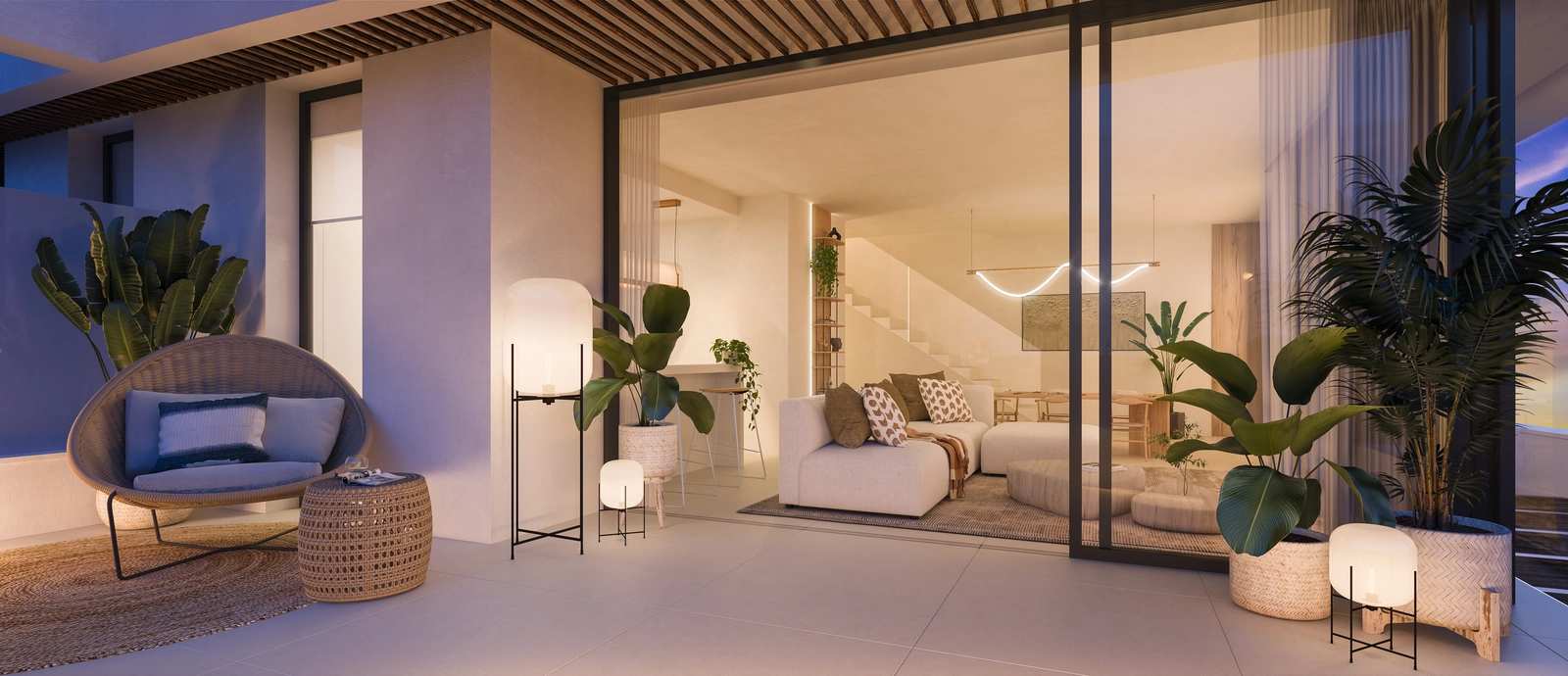 En elegant stue som åpner ut mot en romslig terrasse for et sømløst liv mellom inne og ute.