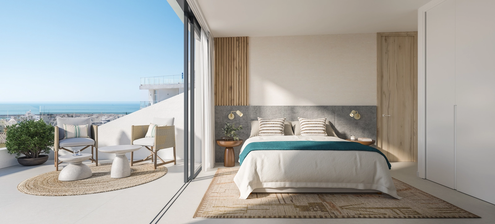 Et lyst og rolig soverom med direkte tilgang til en terrasse med vakker havutsikt.