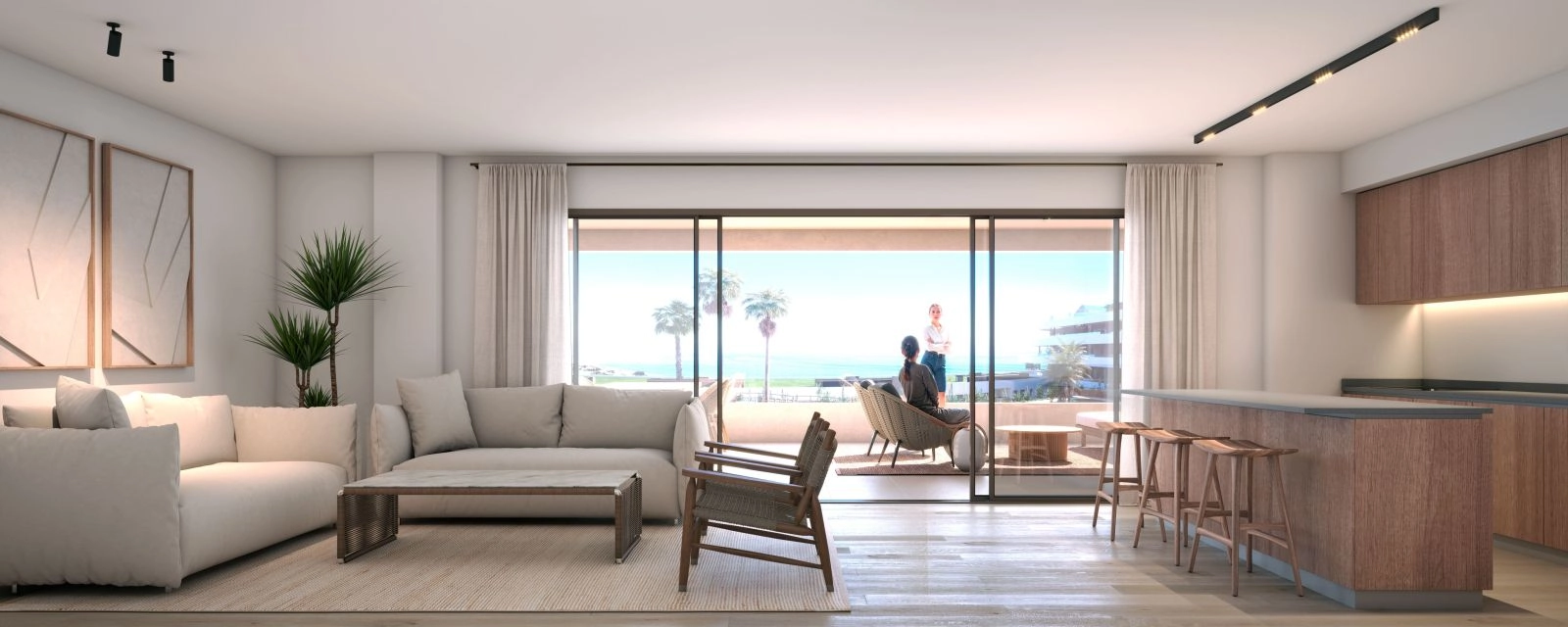En lys og elegant stue som åpner direkte ut mot en privat terrasse med sjøutsikt.