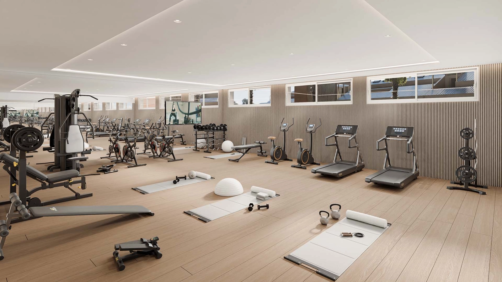 Et fullt utstyrt, toppmoderne treningsstudio for beboernes trening og velvære.