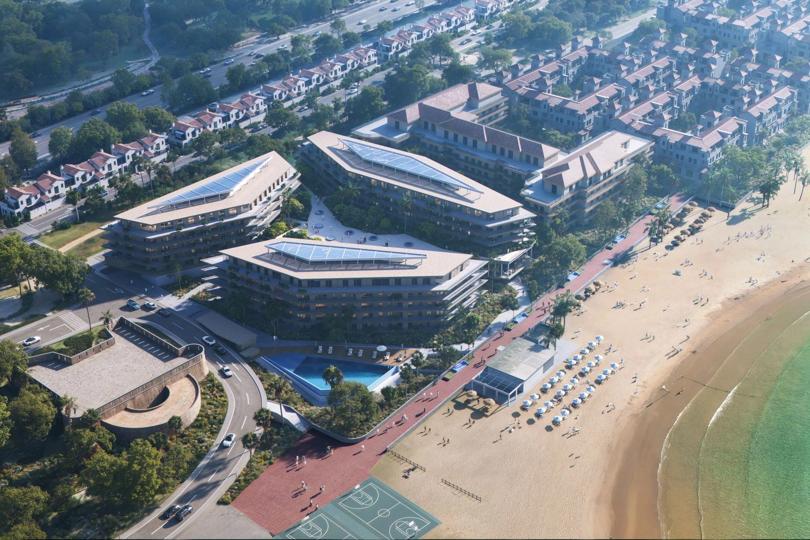 Et fugleperspektiv som viser prosjektets førsteklasses strandbeliggenhet og moderne arkitektur.