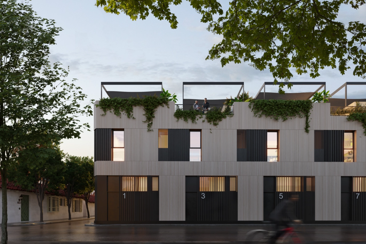 En kveldsutsikt over prosjektet, som viser frem den varme belysningen og elegante arkitekturen.